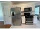 Stainless steel refrigerator, microwave, and stove in updated kitchen at 262 Bomar Ln, Douglasville, GA 30134