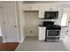 Cozy kitchen with black appliances, white subway tile backsplash and plenty of cabinet space at 262 Bomar Ln, Douglasville, GA 30134