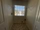 Practical laundry room with washer/dryer hookups and convenient shelving for storage at 262 Bomar Ln, Douglasville, GA 30134