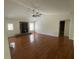 Comfortable living room featuring wood floors and a cozy stone fireplace with wood-burning stove at 262 Bomar Ln, Douglasville, GA 30134