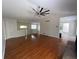 Open concept living room featuring hardwood floors, modern ceiling fan, and ample space at 262 Bomar Ln, Douglasville, GA 30134