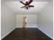 Bright living room featuring dark wood floors and a ceiling fan at 262 Bomar Ln, Douglasville, GA 30134