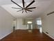 Spacious living room featuring hardwood floors, a modern ceiling fan, and neutral paint at 262 Bomar Ln, Douglasville, GA 30134