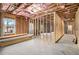 The basement is unfinished with exposed wood framing and a window at 4604 Marching Ln, Fairburn, GA 30213