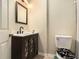 Modern bathroom with stylish vanity, fixtures, and toilet at 4604 Marching Ln, Fairburn, GA 30213