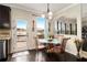 Cozy breakfast nook with a glass table and views of the outdoor deck at 4604 Marching Ln, Fairburn, GA 30213