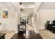 Elegant foyer featuring hardwood floors, neutral paint, and a view into the living spaces at 4604 Marching Ln, Fairburn, GA 30213
