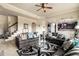 Comfortable living room with stylish furniture, a ceiling fan, and an open view to the kitchen at 4604 Marching Ln, Fairburn, GA 30213