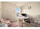 Bright office with a desk, sofa, and geometric decor at 4604 Marching Ln, Fairburn, GA 30213
