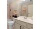 Neutral bathroom with tile surround, framed art, and white vanity at 4900 Fairmont Way, Roswell, GA 30075
