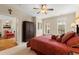 Serene bedroom with a view to another room, a large wardrobe and a ceiling fan at 4900 Fairmont Way, Roswell, GA 30075
