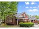 Exterior shot of home with manicured landscaping in neighborhood at 4900 Fairmont Way, Roswell, GA 30075