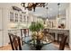 Bright kitchen featuring custom cabinets, stainless appliances, and a glass topped breakfast table at 4900 Fairmont Way, Roswell, GA 30075