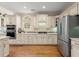 Bright kitchen featuring modern stainless steel appliances, double ovens, and ample storage space at 4900 Fairmont Way, Roswell, GA 30075