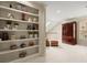 Second floor landing with built-in bookshelves and a decorative cabinet at 4900 Fairmont Way, Roswell, GA 30075