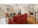 Warm living room with large windows, and seamless access to other areas in the home at 4900 Fairmont Way, Roswell, GA 30075