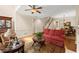 Cozy living room, perfect for entertaining, with staircase, hardwood floors, and elegant furnishings at 4900 Fairmont Way, Roswell, GA 30075