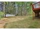 Expansive backyard showing the trees and fence line at 100 Julia Ct, Fayetteville, GA 30214
