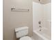 Bathroom featuring a toilet, tub with shower, and towel rack at 100 Julia Ct, Fayetteville, GA 30214