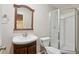 Bathroom featuring a vanity, mirror, and shower with glass doors at 100 Julia Ct, Fayetteville, GA 30214