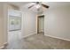 Bedroom with neutral walls, carpet flooring, ceiling fan, and a closet at 100 Julia Ct, Fayetteville, GA 30214