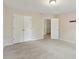 Carpeted bedroom featuring a double door closet at 100 Julia Ct, Fayetteville, GA 30214