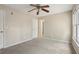 Bedroom featuring neutral walls, carpet flooring, ceiling fan, and a window at 100 Julia Ct, Fayetteville, GA 30214