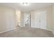 Spacious carpeted bedroom with white doors and natural light at 100 Julia Ct, Fayetteville, GA 30214