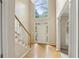 Bright foyer with soaring ceilings, hardwood floors, and elegant staircase that sets a welcoming tone at 100 Julia Ct, Fayetteville, GA 30214