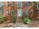 Beautiful brick home featuring a classic front entrance with arched windows at 100 Julia Ct, Fayetteville, GA 30214