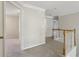 An upstairs hallway with carpet floors and neutral paint at 100 Julia Ct, Fayetteville, GA 30214