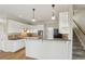 Spacious kitchen with stainless steel appliances, granite countertops, and white cabinets at 100 Julia Ct, Fayetteville, GA 30214