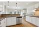 A kitchen with stainless steel dishwasher, white cabinets and granite countertops at 100 Julia Ct, Fayetteville, GA 30214
