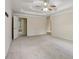 Large main bedroom featuring neutral walls, carpet, and a modern ceiling fan at 100 Julia Ct, Fayetteville, GA 30214