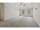 Spacious main bedroom with tray ceilings, carpet floors and natural light at 100 Julia Ct, Fayetteville, GA 30214