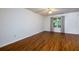 Spacious bedroom featuring wood floors, ceiling fan, and natural light from the window at 137 Venture Path, Hiram, GA 30141