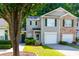Charming townhome with attached garage, well-maintained lawn, and beautiful curb appeal at 137 Venture Path, Hiram, GA 30141