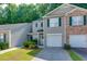 Charming townhouse with attached garage and well-maintained lawn and landscaping at 137 Venture Path, Hiram, GA 30141
