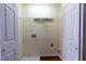 Laundry room with a utility sink and ample storage space at 137 Venture Path, Hiram, GA 30141