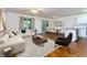 Staged living room and dining area featuring an island and a large sofa at 137 Venture Path, Hiram, GA 30141