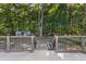 Inviting backyard with a deck and a storage shed nestled among mature trees at 37 Crystal River Dr, Riverdale, GA 30274