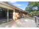 Expansive wooden deck perfect for outdoor entertaining, featuring access to the backyard and sliding glass doors to the home at 37 Crystal River Dr, Riverdale, GA 30274