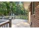 Spacious wooden deck with a railing offers a tranquil outdoor living space with a view of the wooded backyard at 37 Crystal River Dr, Riverdale, GA 30274
