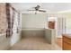 Dining room with tiled floor, neutral walls, window, and view into adjoining room at 37 Crystal River Dr, Riverdale, GA 30274