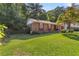 Well-kept single-story brick home with a spacious lawn, ideal for outdoor enjoyment at 37 Crystal River Dr, Riverdale, GA 30274