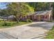 Brick home with a paved driveway and well-kept front yard, creating a welcoming facade at 37 Crystal River Dr, Riverdale, GA 30274