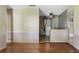 Living room with hardwood floor, neutral walls, window, and view into adjoining room at 37 Crystal River Dr, Riverdale, GA 30274
