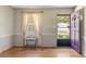 Living room featuring hardwood floors, neutral walls, a front-facing window and a door at 37 Crystal River Dr, Riverdale, GA 30274