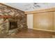 Comfortable living room with brick fireplace, wood-look flooring, and neutral decor at 37 Crystal River Dr, Riverdale, GA 30274