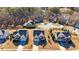 An aerial view showcases a neighborhood with well-maintained homes and landscaping near a wooded area and small body of water at 3835 Rifflepool Ct, Douglasville, GA 30135